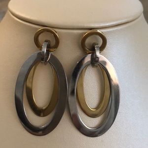 Stainless steel white and yellow oval earrings.
